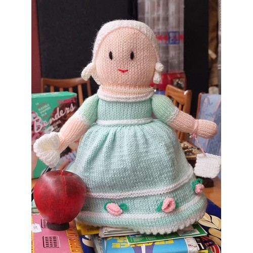 918 - A wonderful handmade knitted woolen reversable doll. One side features a doll with brown plaited hai... 