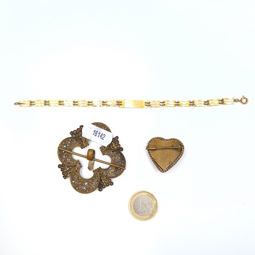 7 - A collection of three antique items, consisting of an unusual gold plated gate bracelet, set with an... 