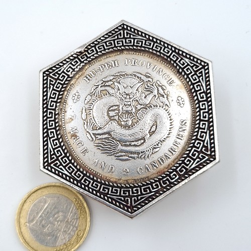 12 - A Chinese hexagonal pill box, set with profuse inlayed coins to face and reverse and featuring fabul... 