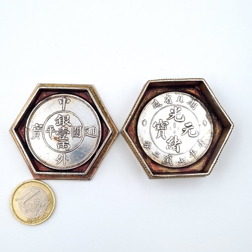 12 - A Chinese hexagonal pill box, set with profuse inlayed coins to face and reverse and featuring fabul... 