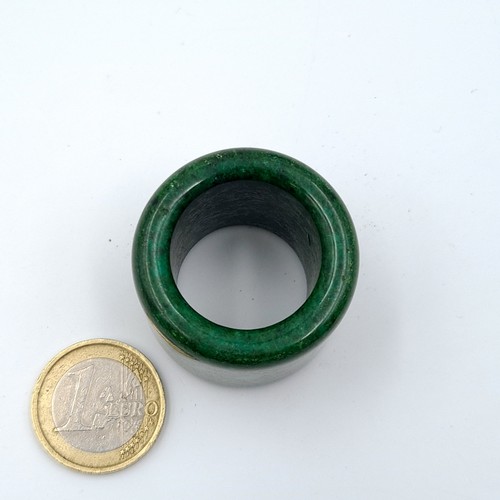 17 - An interesting and rare heavy Chinese Nephrite archers ring. Weight: 43 grams.