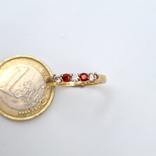 19 - A fabulous 9 carat gold (stamped 375) five stone ruby and moissainte ring. Ring size: P. Weight: 2.0... 