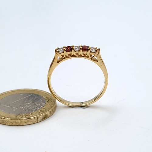 19 - A fabulous 9 carat gold (stamped 375) five stone ruby and moissainte ring. Ring size: P. Weight: 2.0... 