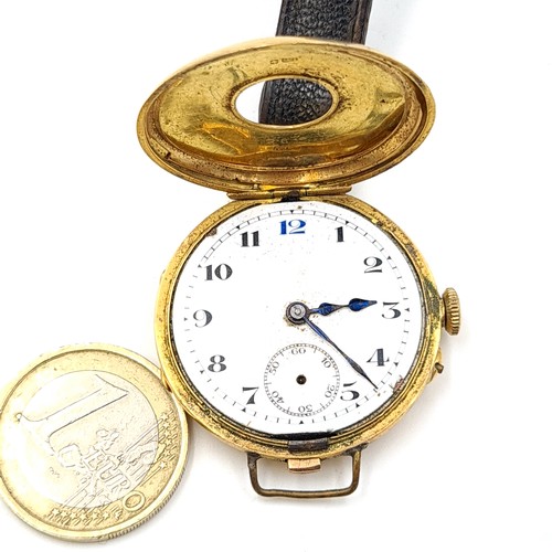 872 - Star Lot : A fine example of a vintage Half Hunter wrist watch, set with an 18 carat gold casing mar... 