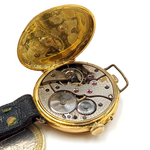 872 - Star Lot : A fine example of a vintage Half Hunter wrist watch, set with an 18 carat gold casing mar... 