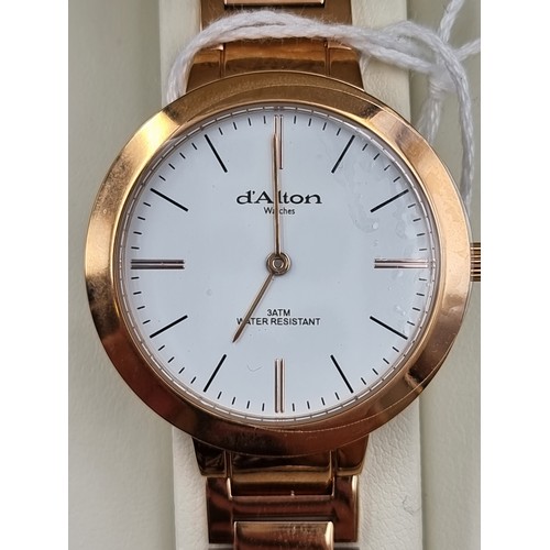 21 - An as new D'alton of Paris ladies Rose gold toned wrist watch, featuring an enamelled dial, baton ma... 