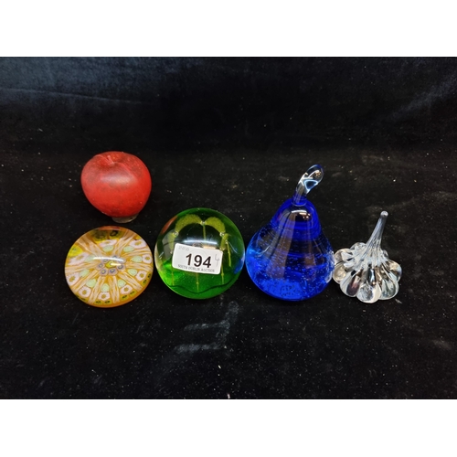 194 - A mixed lot of four handblown glass paper weigghts. Including two charming Caithness examples includ... 