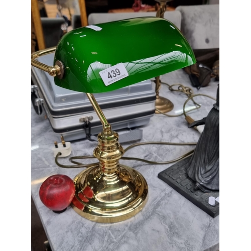 439 - A classic brass Banker's lamp with a green glass shade. Sporting a three pin plug.