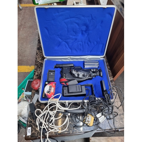 445 - A vintage 8mm Sony Handycam Pro camcorder with accessories. In a aluminium fitted case. James Bond s... 