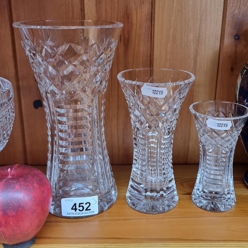 452 - A set of three beautiful Waterford Crystal graduating vases. All in excellent condition with acid et... 