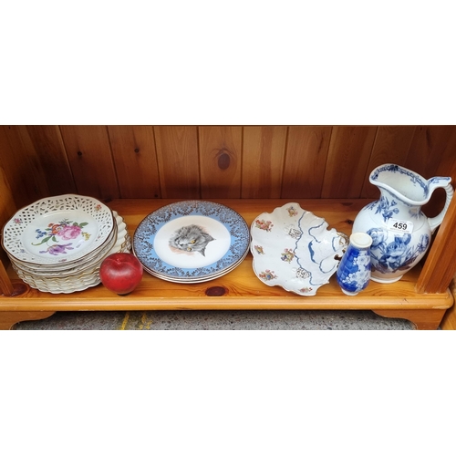 459 - A collection of fourteen porcelain items including three Cruse & Co pierced wall plates with two Liv... 