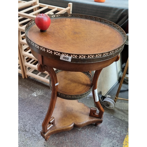 460 - Star lot - A handsome three-tier occasional table by Theodore Alexander London with tooled leather i... 