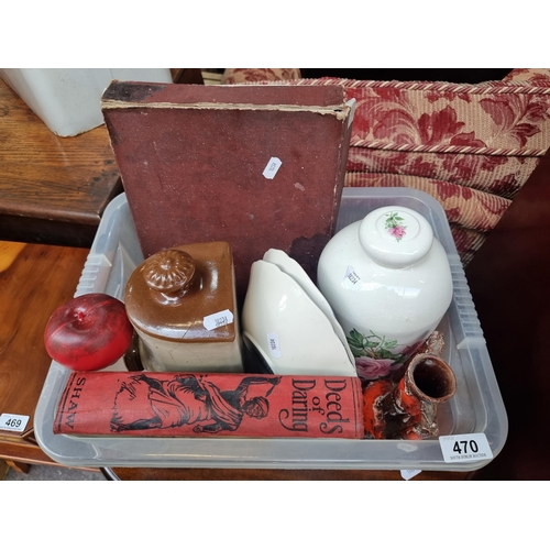 470 - A box containing eight collectable vintage items. Including two ceramic hot water bottles and a neat... 