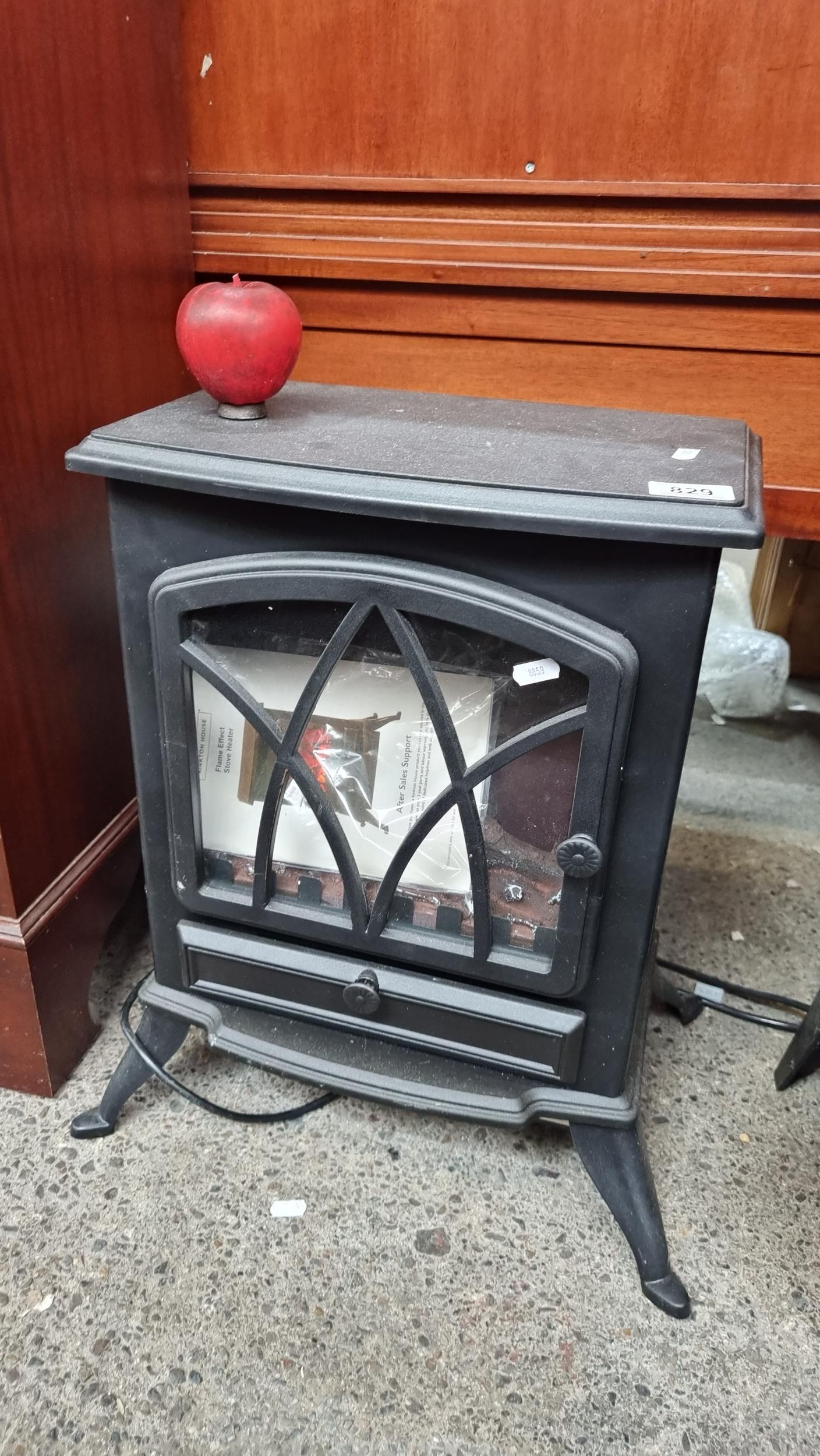 An electric indoor Flame Effect Stove Heater from Kirkton House. With a  three-pronged plug and instr