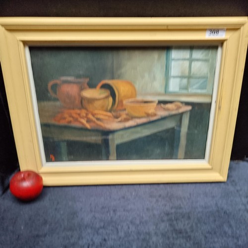 510 - A framed original oil on canvas painting of a still life scene. Depicting carrots and onions laid am... 