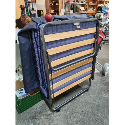 924 - A very practical foldaway single guest bed with accompanying mattress and dust cover. In excellent c... 