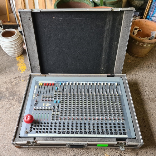 934 - Star Lot : A very large Soundcraft Spirit Live 4 mixing console housed in a hard travel flight  case... 