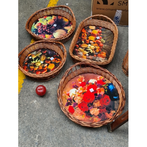 956 - A set of  brand new four wicker baskets with vibrant bases featuring images of harvest vegetables an... 