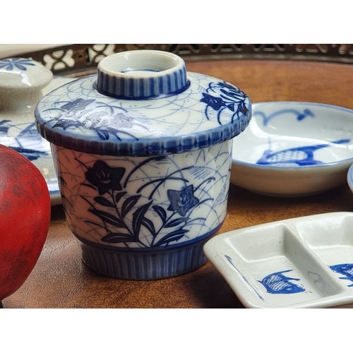 435 - A neat sized box filled with approximately thirty Japanese and Chinese porcelain and ceramic pieces.... 