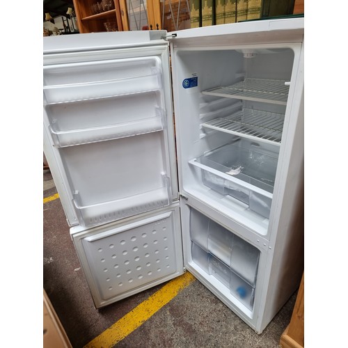 465 - A Beko standing refrigerator with freezer storage to base. CS5342APW. Total capacity 200L. Voltage 2... 