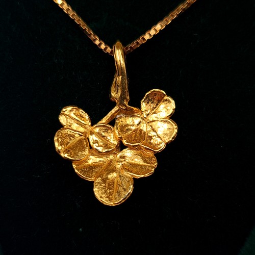 8 - Two boxed hammered gilded silver leaf figure pendant and chain by Irish Shamrock designs. Each stamp... 