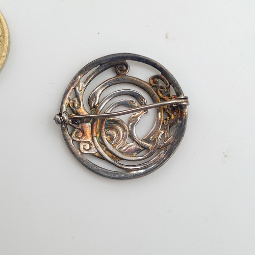 13 - A pair of silver (unmarked) Celtic revival brooches, both referencing the Children of Lir. Pins inta... 