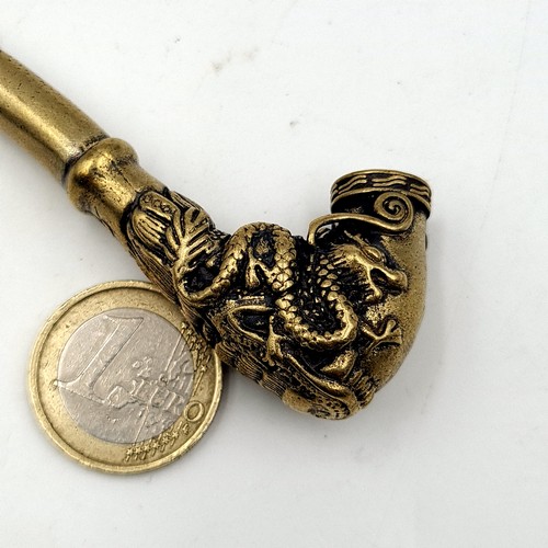 29 - An interesting brass Chinese pipe, set with intricately finished Foo Dog finial bowl and set with to... 