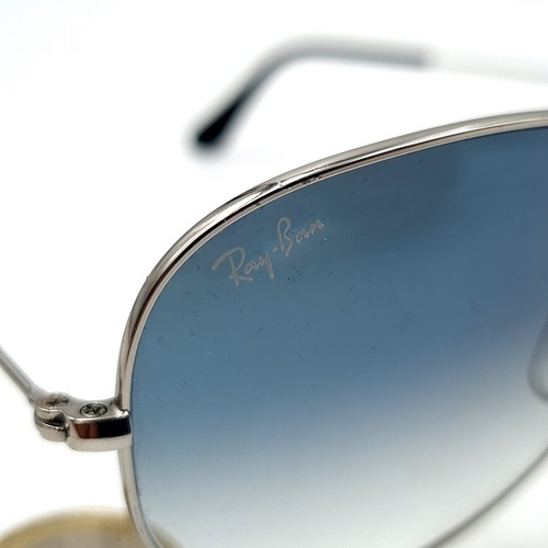 34 - A pair of genuine Ray-Ban aviator sunglasses, featuring metal frames and rare light blue lenses. Len... 