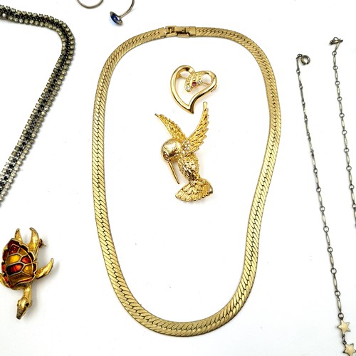 55 - A collection of vintage  jewellery, comprising of necklaces, brooches, pendants and earrings.