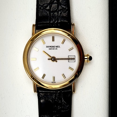 58 - Star lot : A Raymond Weil ladies wrist watch, set in 18 carat electro-plated gold finish. This watch... 