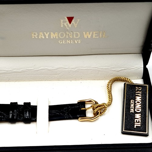 58 - Star lot : A Raymond Weil ladies wrist watch, set in 18 carat electro-plated gold finish. This watch... 