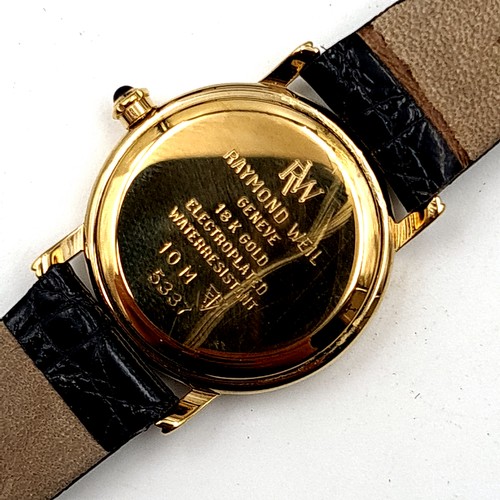 58 - Star lot : A Raymond Weil ladies wrist watch, set in 18 carat electro-plated gold finish. This watch... 