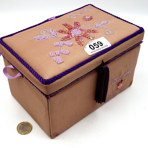 59 - A three drawer jewellery box, containing good quality costume jewellery consisting of three cocktail... 