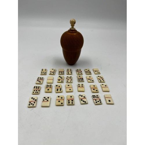 6 - A fabulous antique  Japanese carved Coquilla nut containing a domino set. Dimensions: 8cm x 4cm. Wei... 