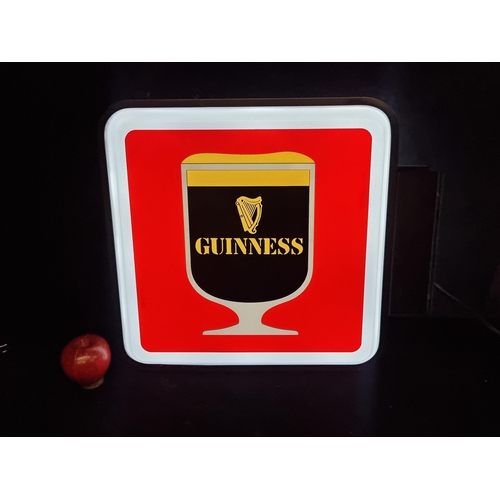 109 - A large Guinness double sided advertising sign in the traditional Guinness colourway, complete with ... 