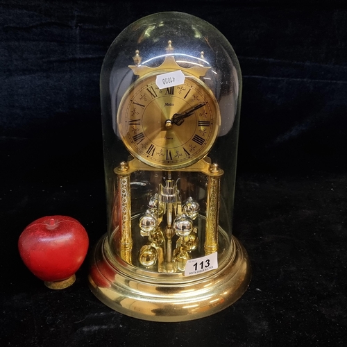 113 - A beautiful Motiz Quartz dome clock. With Quartz rotating pendulum, base, columns and crown with bra... 