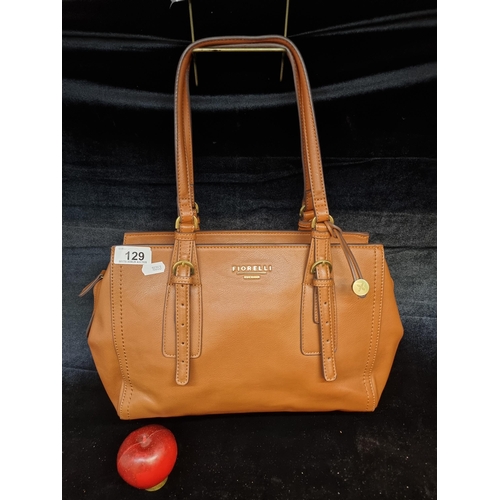 129 - A beautiful Fiorelli tan leather handbag. In good condition and additional zip pocket to interior.