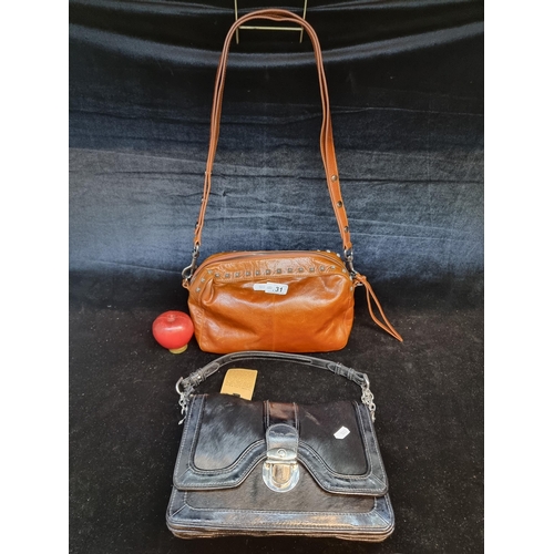 131 - Two stylish ladies handbags including an Adolfo Dominguez example along with a stylish Marks and Spe... 