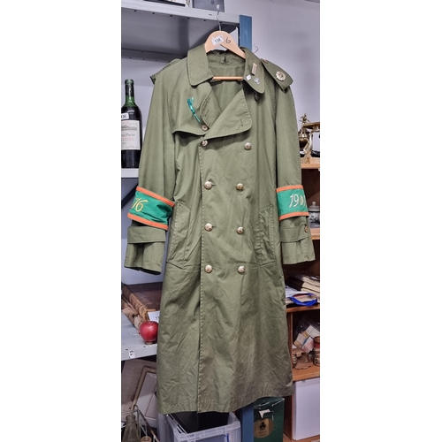 138 - Star Lot : A wonderfully detailed Irish Military rain jacket with fabulous harp buttons to front, hi... 