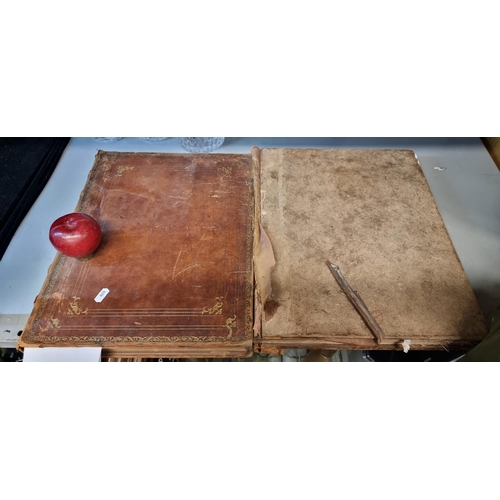 139 - Two large antique hardback books titled 