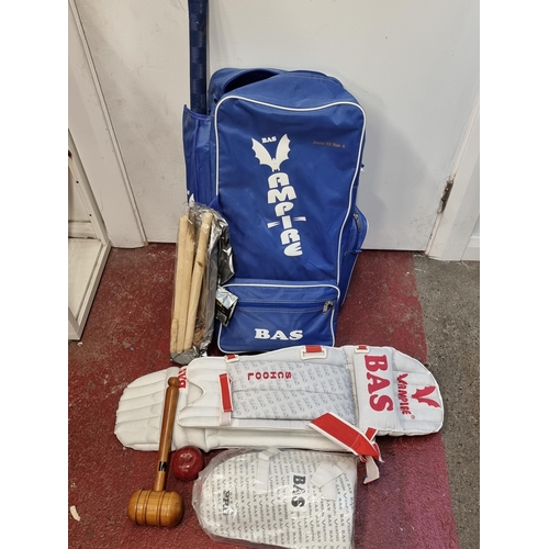 140 - A complete BAS (Beat All Sports) Junior cricket set comprising of a bat, stumps, protective knee pad... 