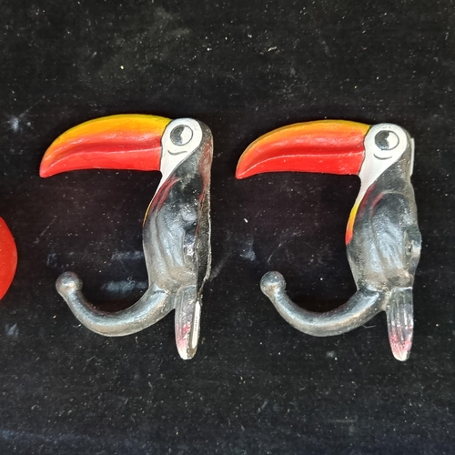 155 - A pair of handpainted cast metal coat hooks in the form of the Guinness toucan. Great heavy examples... 