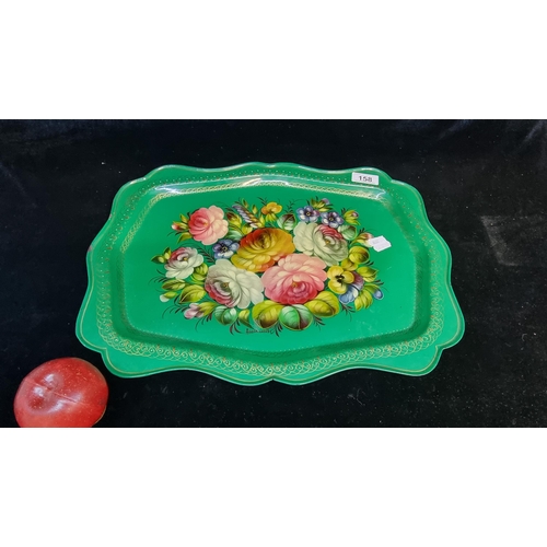158 - A handpainted cast metal serving tray. Handpainted with a bloom of peonies and pansies on a green gr... 