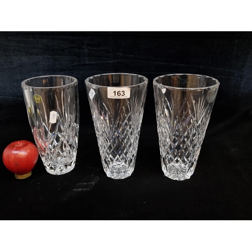 163 - Three crystal vases including a matching pair with diamond quilt detailing. All in good condition (3... 