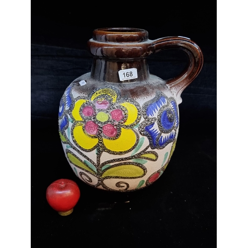 168 - An exceptional and large vintage West German pottery vase. Featuring a tactile floral pattern on a d... 