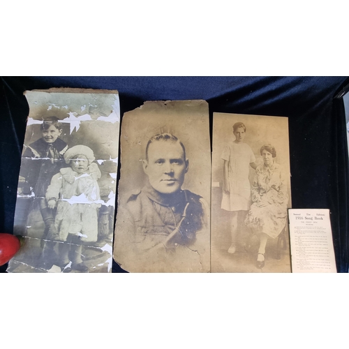 187 - Four antique items including three large photograph prints on board and a 1930 edition of the 1916 s... 