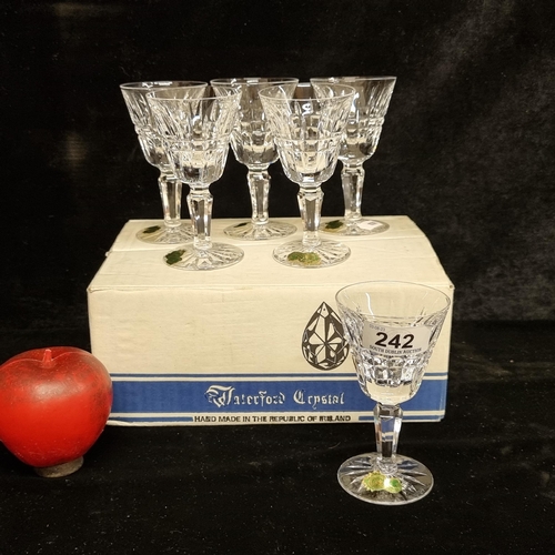 242 - A set of six Waterford Crystal glasses in the Glenmore pattern. In very good condition and with vint... 