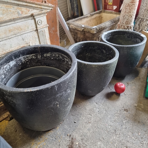 849 - Three heavy quality ceramic  garden planters in a stylish black finish, two smaller examples and one... 