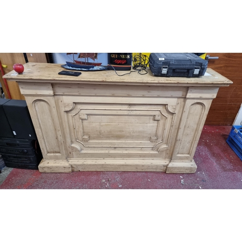 858 - Star Lot - An antique wooden shop counter with recessed and paneled front and two generous shelves t... 