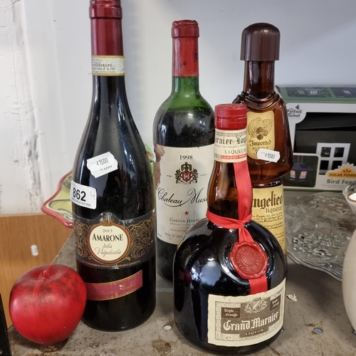 862 - A selection of four sealed bottles of vintage liqueurs. Including a 2013 Amarone, a Grand Marnier, F... 